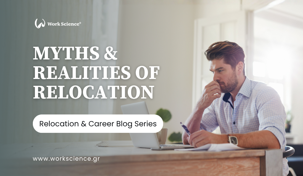 The image shows a man, dressed in a light-colored button-down shirt, sitting at a wooden desk with a laptop and papers, looking thoughtful or concerned with his hand near his chin. Sunlight streams in from the side, creating a bright, somewhat reflective atmosphere.