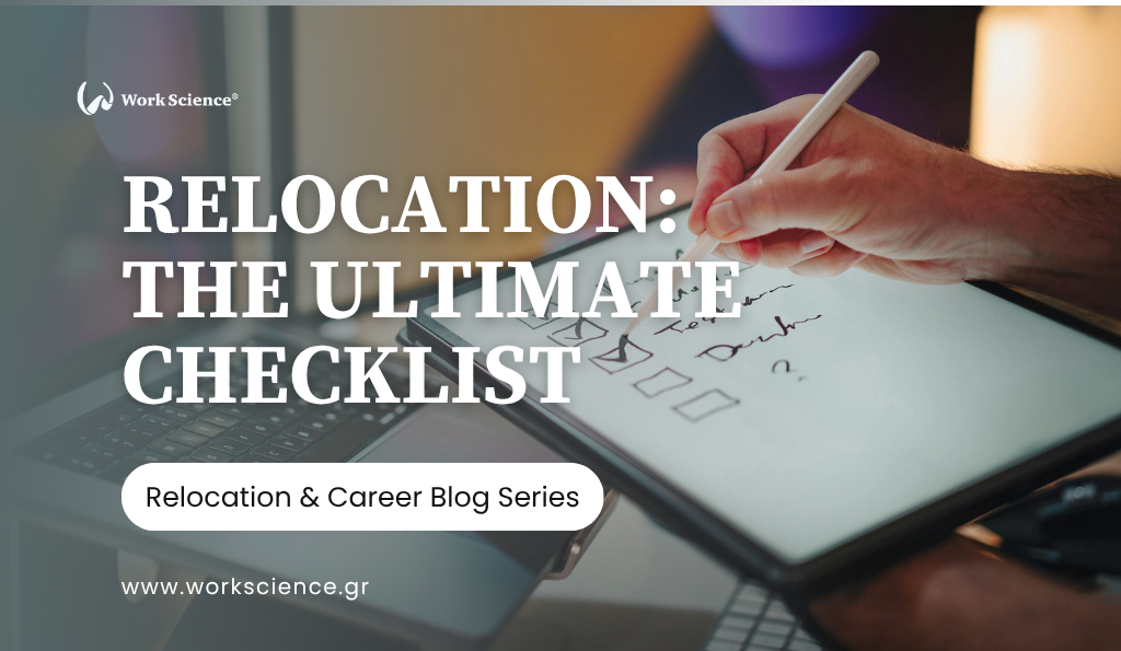 Close-up of a person's hands writing on a notepad beside a modern computer screen, focusing on planning and organization in the office.