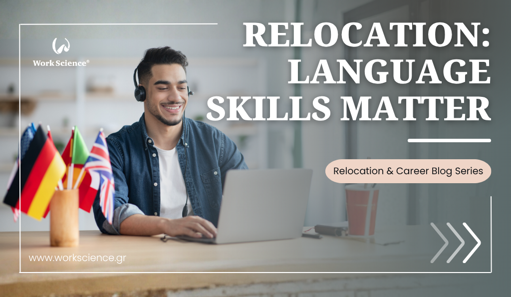 A smiling man wearing a headset looks at a laptop next to a stand holding flags of multiple countries (e.g., Germany, UK), symbolizing the importance of language proficiency for successful relocation and remote work.